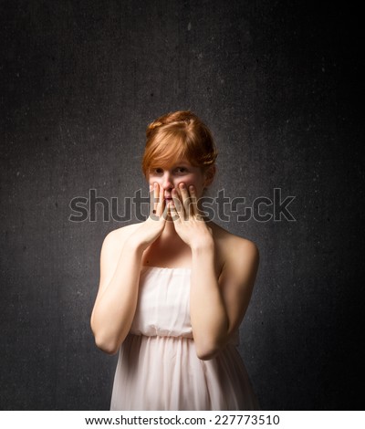 woman touching and hide face with hands open