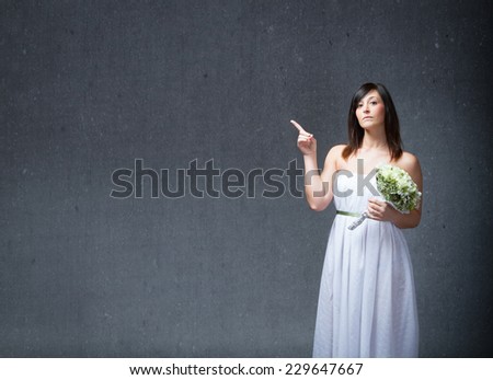 bride indicated empty space with finger up