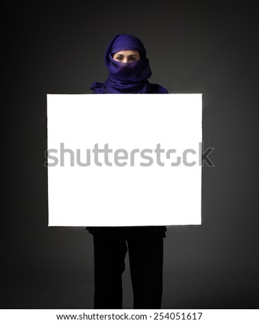 muslim woman with white empty board on hand