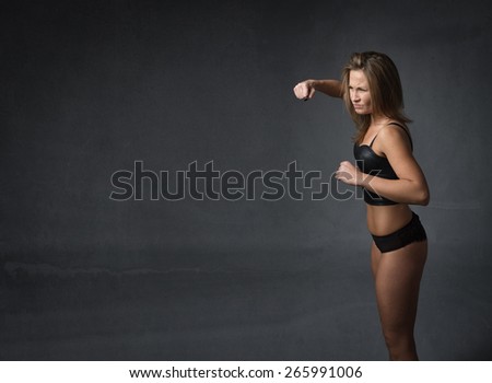 woman ready for fight, dark background