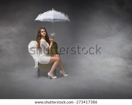 bad weather from sky concept, angel with umbrella