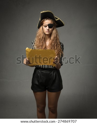 pirate looking for treasure with yellow map, dark background