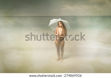 beach bad weather situation, tourist with umbrella on head