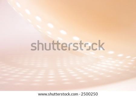 Abstract salmon and orange pastel pattern of circles.