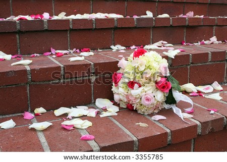 Rose and hydrangea bouquet on church steps.