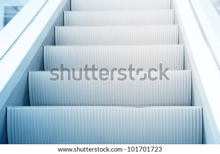 Clean beautiful blue escalator way up concept
