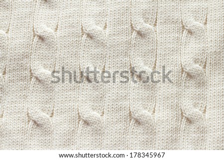 Knitted woolen fabric textile texture close-up