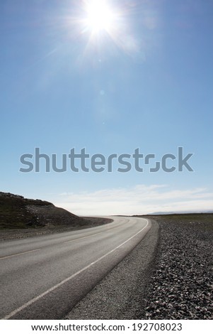 Vertical photo with asphalt road in sunny day