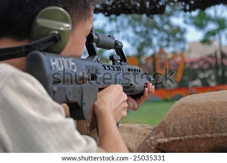 firing machine gun in the army camp