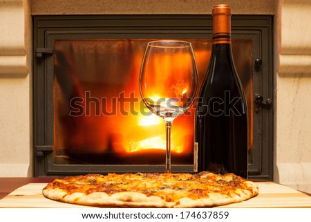Pizza and wine at the fireplace