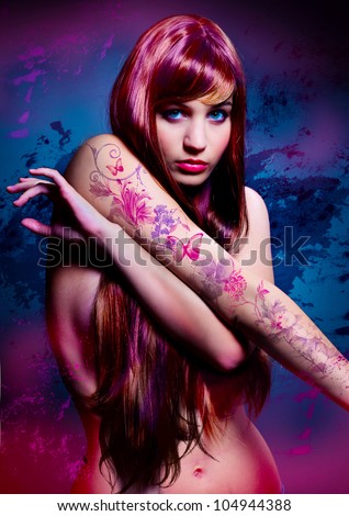 beautiful girl with colored hair and tattoo