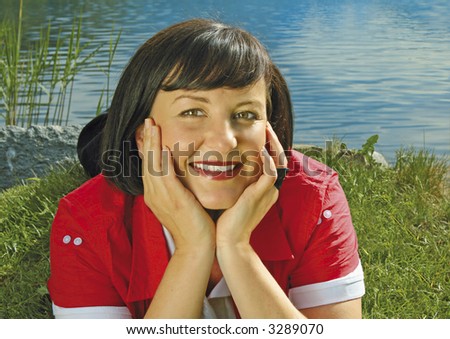 girl enjoying the sun by a beautiful lakeside. More pictures of her in my portfolio.