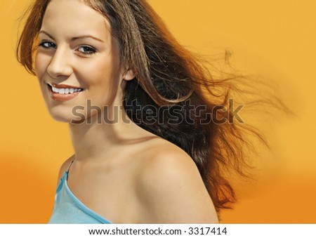 beautiful girl in front of orange background. More pictures like this in my portfolio.