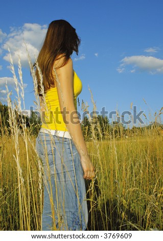 girl in high grass on a sunny day. unique keyword for this collection: grassland77