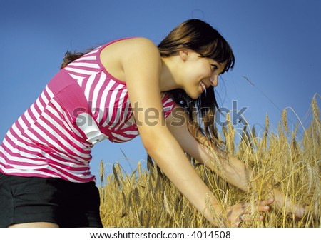 young girl in a cornfield. Unique keyword for this collection: happy77