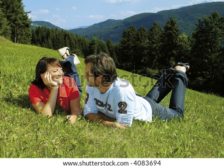 Playful couple is resting in the nature. Unique keyword for this collection: lovely77