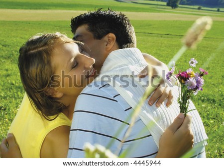 Young, married couple in a meadow. keyword for this collection is married77