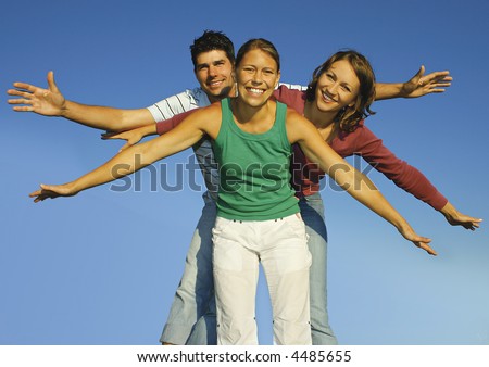 Three friends fooling around on a summerday. keyword for this collection is family7