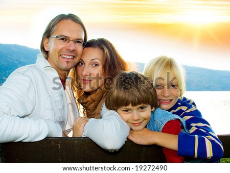 family time - a cute family in the sunset