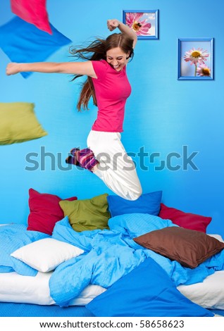 young teenage-woman is in a pillow-fight (my flower photos)