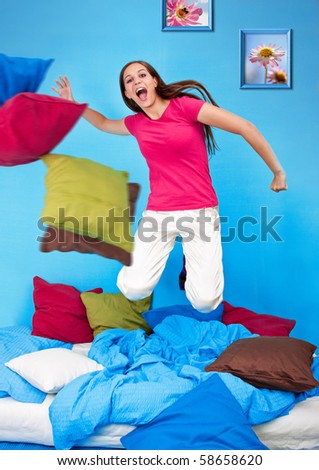 young teenage-woman is in a pillow-fight (my flower photos)