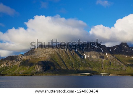 Norwegian coastline with bridge spanning between two islands on Lofoten during arctic summer