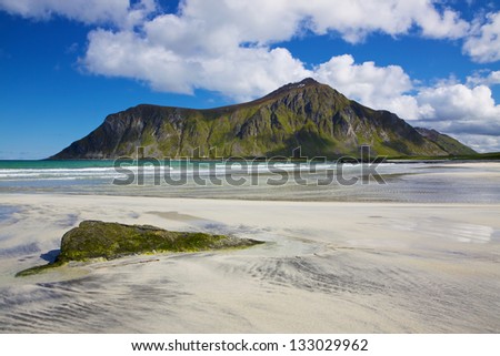 Picturesque sandy beach on Lofoten islands in Norway on sunny summer day