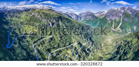 Mountain road in Gaularfjellet mountain pass in Norway surrounded by magnificent mountains