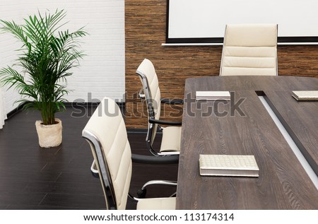 A Large Table And Chairs In A Modern Conference Room Stock Photo ...
