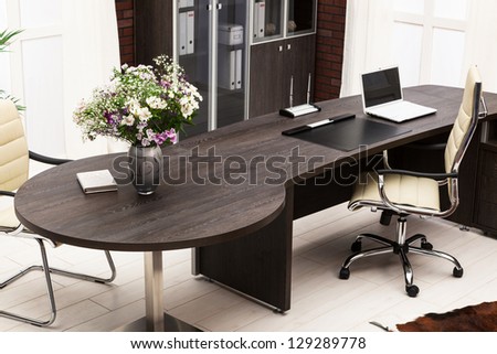 bouquet of flowers on a desk at modern office
