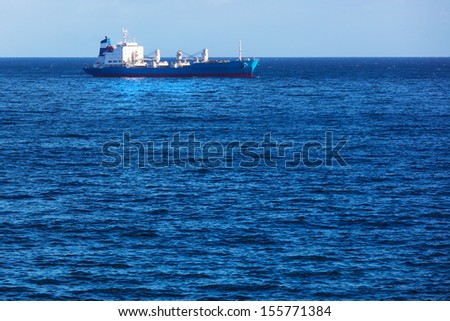 cargo ship in the ocean in the sky