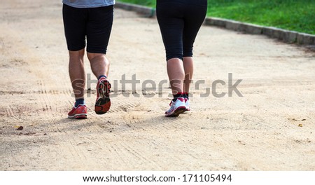 running man and a woman in the park