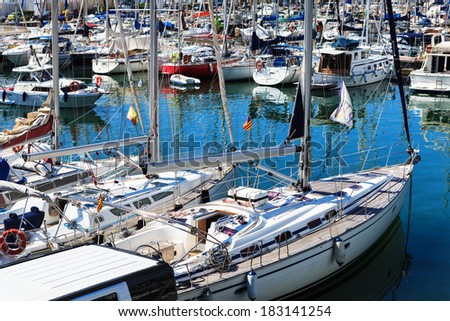 a modern yachts docked in the port