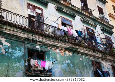 drying clothes on the balcony of the old building