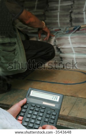 The bookkeeper in a warehouse of polygraphic production