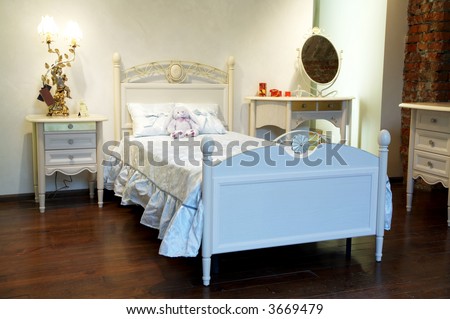 Beautiful bed and toy in a children\'s bedroom