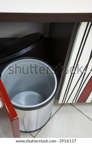 Empty garbage can on new and modern kitchen
