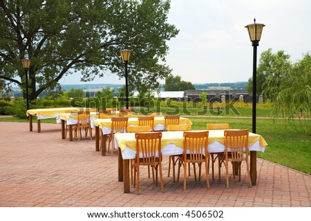 Tables and chairs in cafe on fresh air