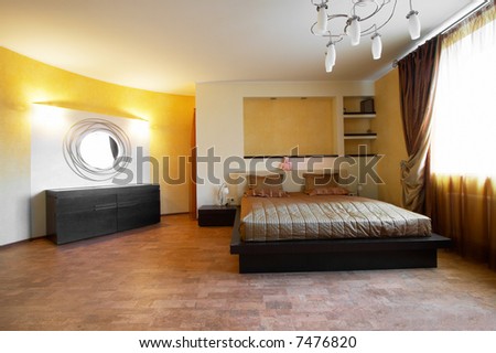Bedroom with a mirror on a wall in hotel