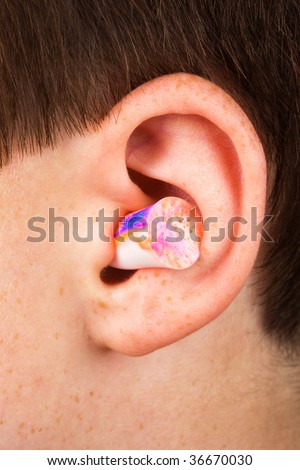 color earplug into the ear close up