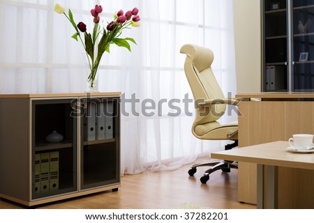 Flowers on a background of a window at modern office