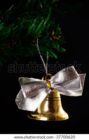 gold bell on the artificial Christmas tree