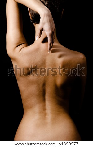 stock photo Girl with a naked back and short hair