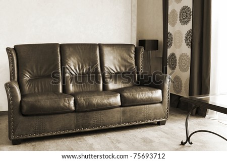 Beautiful leather sofa and table at a window