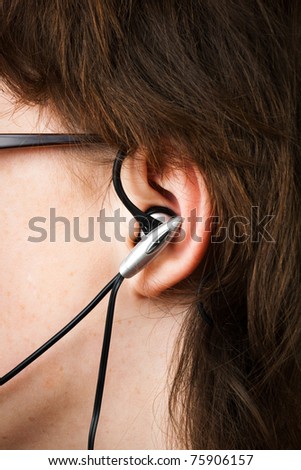 modern earphone in ear  teenager close up