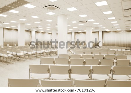 large and modern white auditorium with curtains