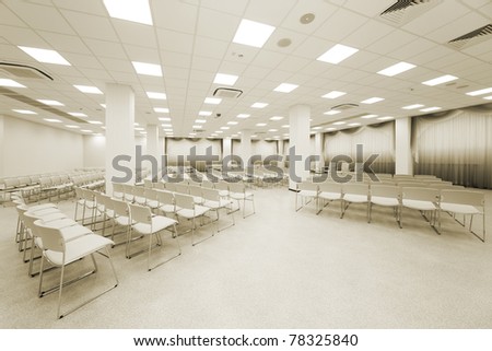 large and modern white auditorium with curtains