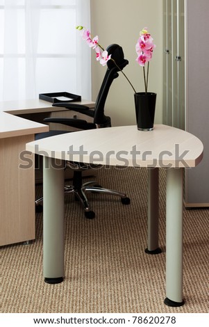 orchids on the table in a modern office