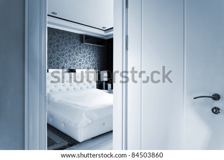 beautiful white bedroom\'s open door