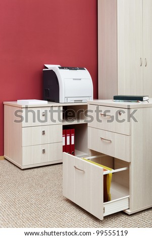 printer from the cabinet in a modern office